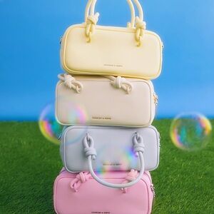 Charles & Keith Yellow and Cream Mini Bags with Elegant Silhouette